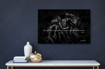 A black and white photograph of two individuals embracing, displayed on a canvas, mounted on a wall.