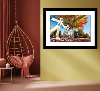 Metal art photograph of children holding hands on a fall day in Decatur, Alabama, with colorful autumn leaves.