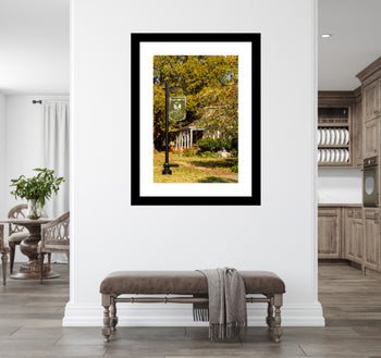 Photograph of Walden Oaks Park in Old Decatur, Alabama, featuring oak trees, sunlight, and a peaceful Southern park setting mounted on a wall.