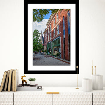 A photo of Harrison Brothers and Commerce Kitchen buildings at a street angle.