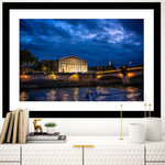 Pont de la Concorde Bridge at night with glistening reflective waters.