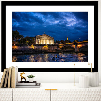 Pont de la Concorde Bridge at night with glistening reflective waters.
